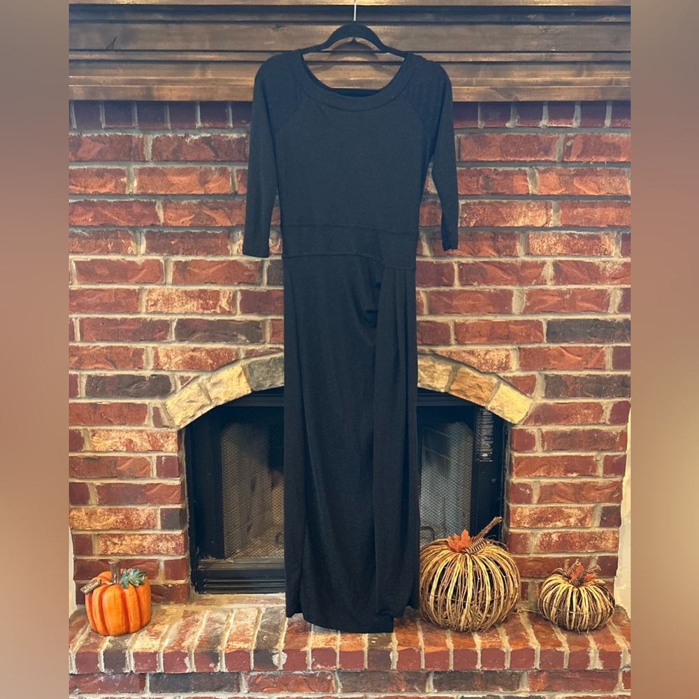 Shimmering black evening dress with high left slit